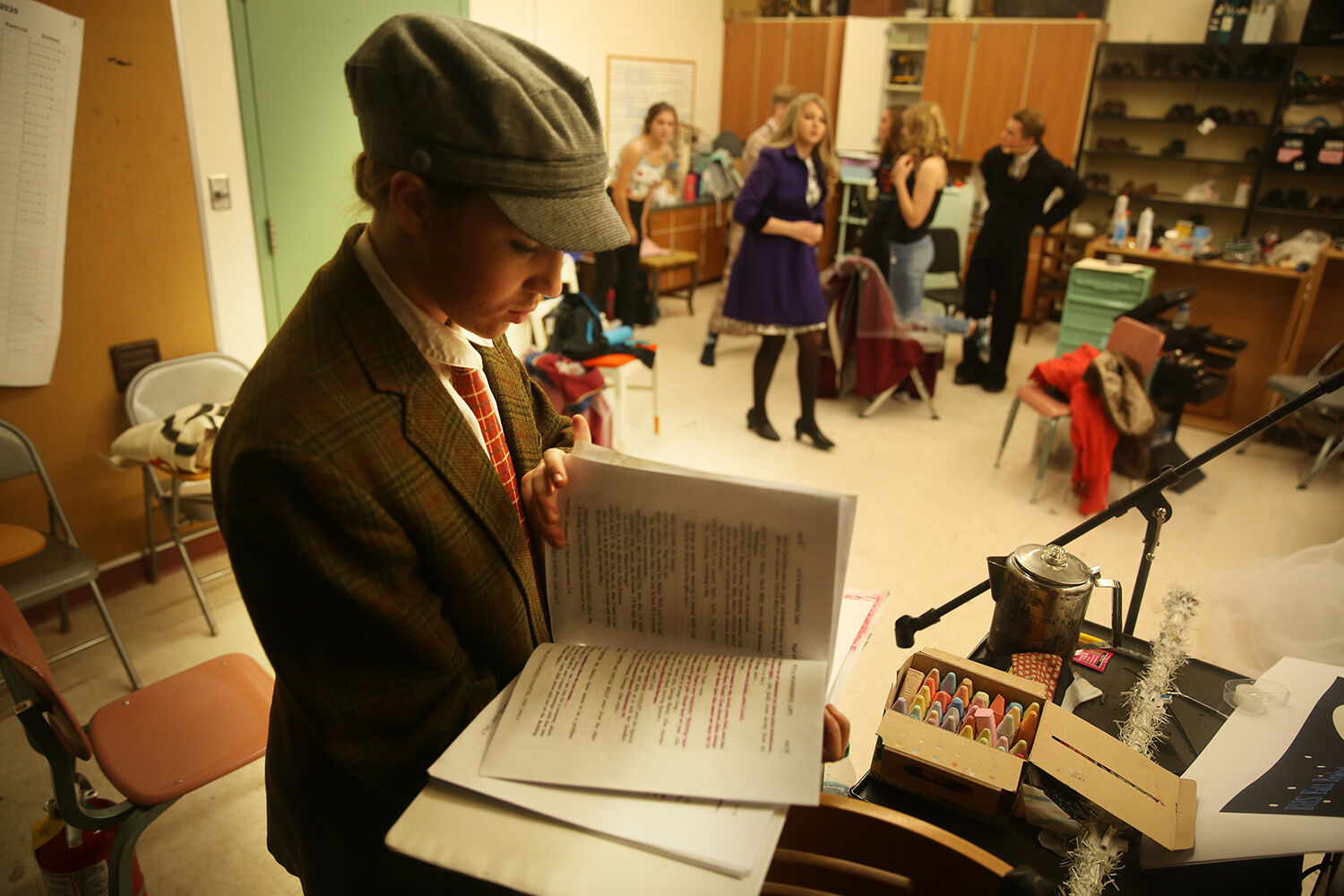 Carly Norman checks her script during the intermission of the performance
